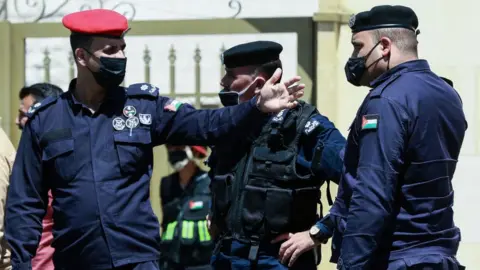 Security personnel outside the State Security Court in Amman, Jordan (12 July 2021)