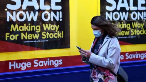 Getty Images Woman walks in front of The Works store
