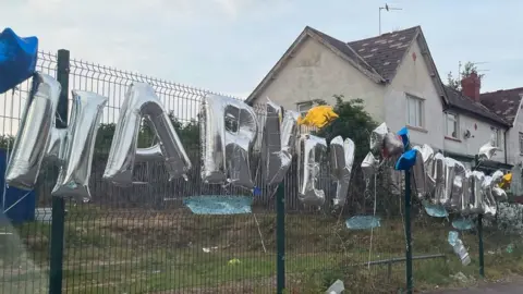 PA Media Tributes were left to the two teenagers who died in Ely