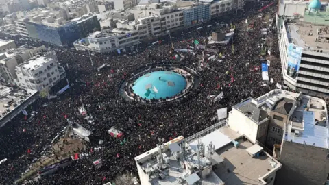 EPA A handout photo made available by the Iranian supreme leader's office shows an areal view of Qasem Soleimani's funeral in Tehran, 6 January 2020