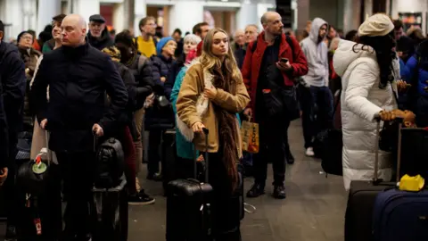 EPA Passengers wait at King's Cross whilst signalling issues prevented train services running on various routes from Kings Cross and St Pancras