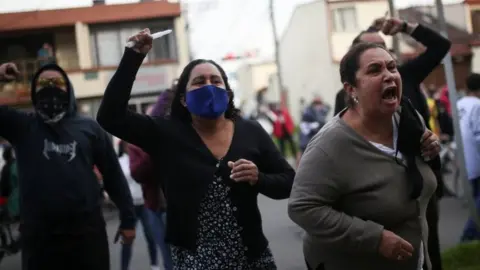 Reuters People protest outside a police station after a man, who was detained for violating social distancing rules, died from being repeatedly shocked with a stun gun by officers, according to authorities, in Bogota, Colombia September 9, 2020.