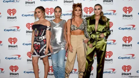 Getty Images Little Mix pose together on Friday.