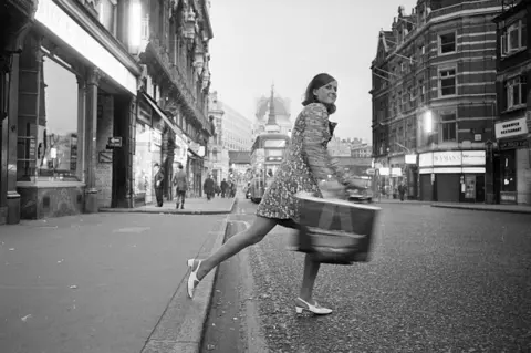 Getty Images A fashion reporter for a daily newspaper on Fleet St in the 1960s