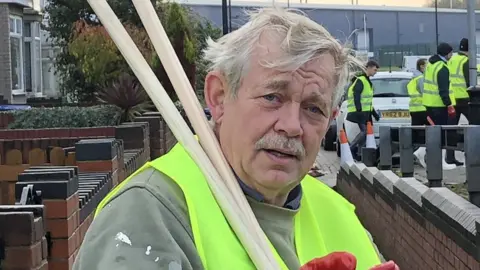 A volunteer involved in the clean-up effort