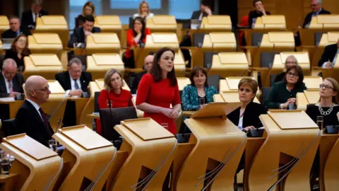 Getty Images Public finance minister Kate Forbes unveils the Scottish government"s spending pledges