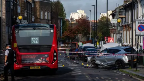 Getty Images Scene of the incident showing bus and destroyed car