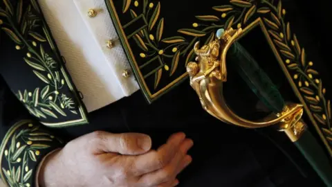 AFP An academy member in official dress