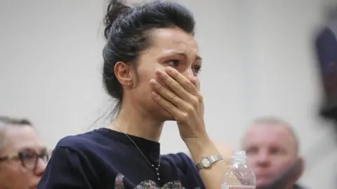 EPA Employee of the Ukraine International Airlines (UIA) company reacts during a press conference at Boryspil International Airport in Kiev, Ukraine, 08 January 2020