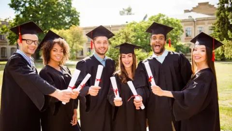 Getty Images Students graduating from university