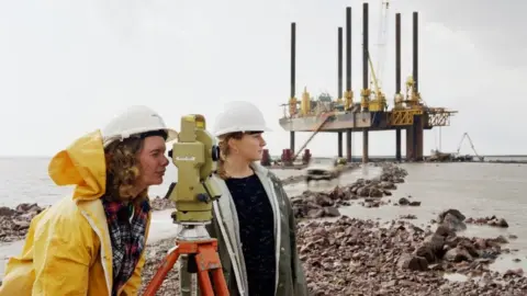 Historic England/John Laing Collection Women do measurements at bridge site