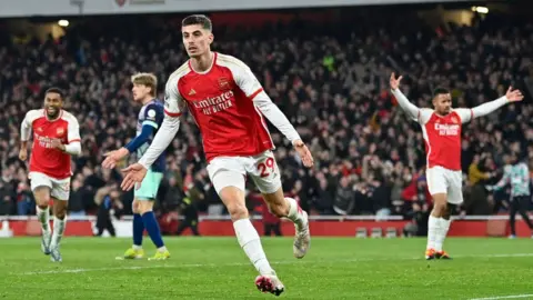 Arsenal players celebrate Kai Havertz's winner