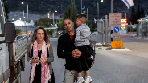 AFP Yael Noy (left) drives sick Palestinians, mostly children, across checkpoints to hospital appointments