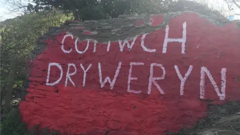 The wall being rebuilt