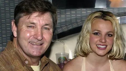 Getty Images Britney Spears alongside her dad Jamie in 2006