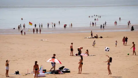 PA / Ben Birchall People at the beach