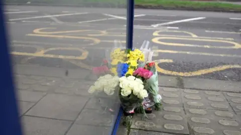 Flowers at a bus stop