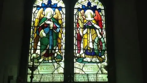 The stained glass window which honours Able Seaman Richard Morgan and his friends who also died