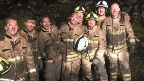 South Wales Fire and Rescue The fire crew with Georgie
