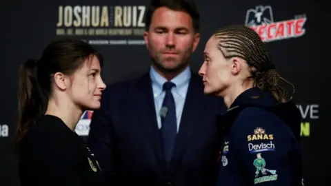 Reuters Katie Taylor, Eddie Hearn and Delfine Persoon