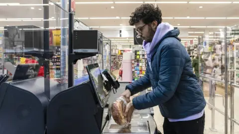 Getty Images Stock image of a man using a self-scan