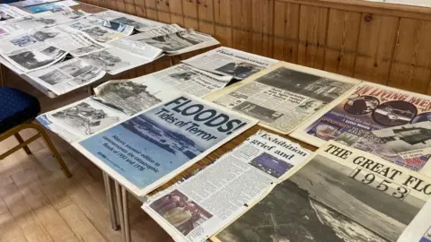 Jill Bennett/BBC Newspaper cuttings reporting the floods of 1953