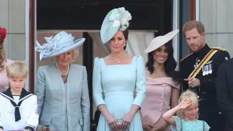 PA The royals gathered on the balcony at Buckingham Palace to watch the flypast