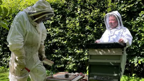 Lou Washington and her bee-keeping neighbour