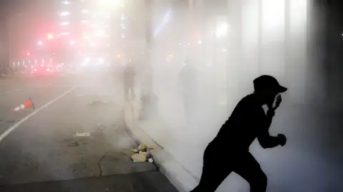 Getty Images Tear gas fired in Detroit