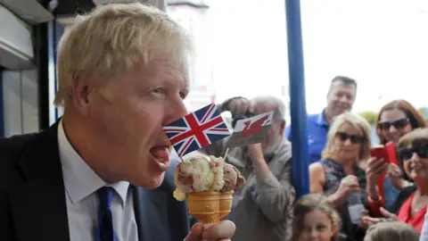 Getty Images Boris Johnson eats an ice cream