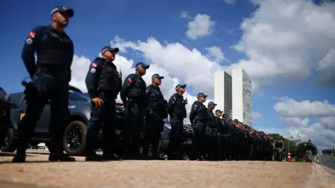 Reuters Police guards