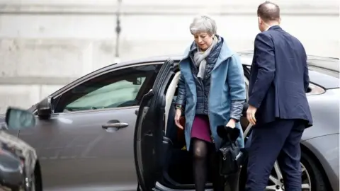 Reuters Theresa May getting out of car