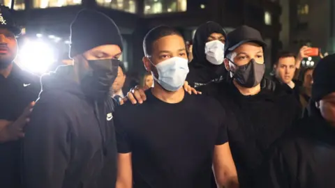 Getty Images Jussie Smollett (second left) leaving Cook County jail in Chicago