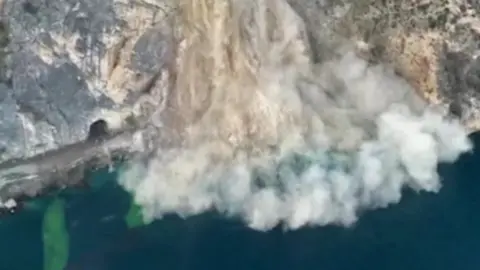 Landslide plunging into lake in Italy