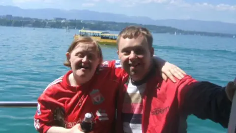 Family Photo Alison Williams and Michael Gallagher with a sea view in the foreground