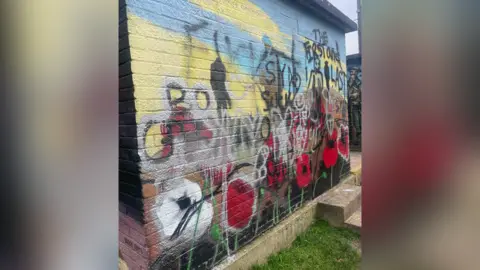 Witham Town Council Spray paint over a war mural in Witham in Essex