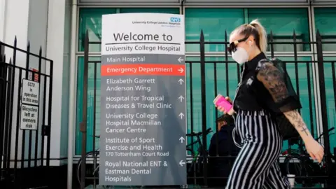 Getty Images Woman walking past UCH