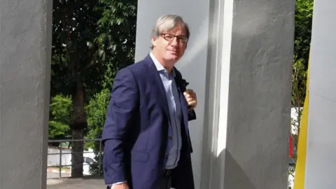 AFP BBC foreign correspondent Jonathan Head arrives at court to fight defamation charges brought against him by a Thai lawyer in Phuket on 23 August 2017.