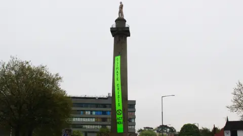 Sal Mager Lord Hill's Column with protest banner