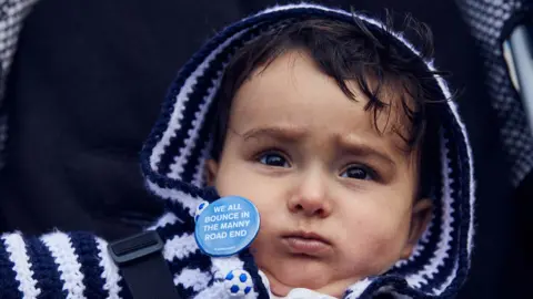 BBC Byron wearing a Bury FC badge