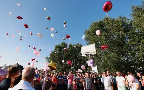 Liam McBurney Mourners release balloons at Chloe Mitchell vigil in Ballymena