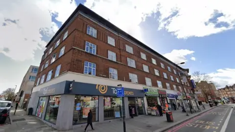 Google Google StreetView image of Astoria Mansions, an apartment block which is located above a row of shops