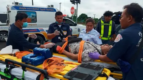 Reuters An injured person is cared for by rescue workers