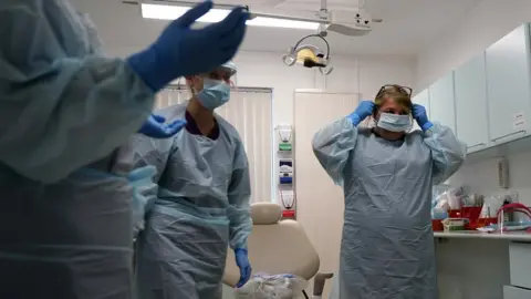 Getty Images Nurses wearing protective equipment