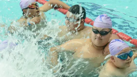 Getty Images Obese students at a weight loss summer camp in Zhengzhou, China