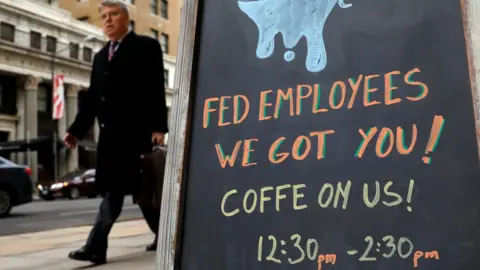 Reuters Sign reads: "Fed employees we got you -- coffee on us"