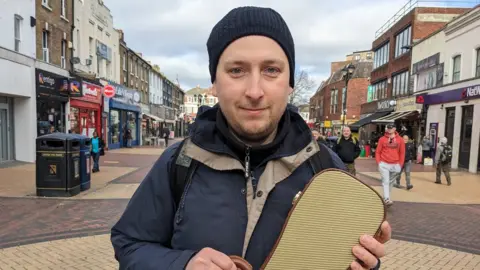 Peter Walker/BBC Victor who busks in Grays high street