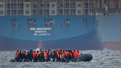 PA Media A group of people thought to be migrants in the English Channel last year