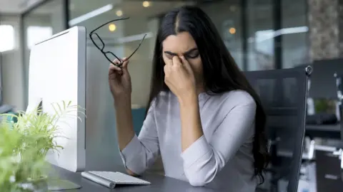 Getty Images Businesswoman with computer problems