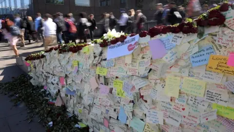 Reuters Messages of condolence on wall